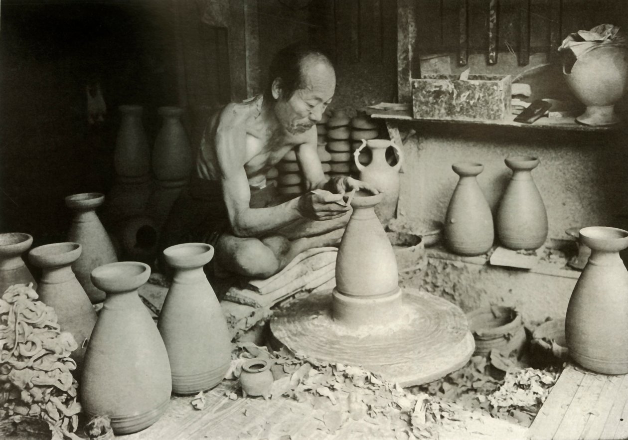 Garncarz za swoim kołem, 1910. autorstwa Herbert Ponting
