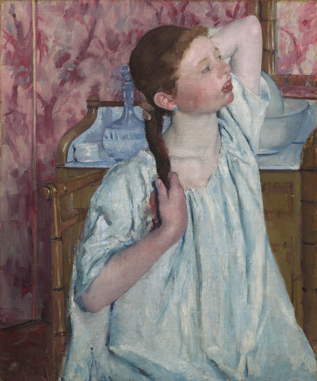 Dziewczyna układa włosy autorstwa Mary Cassatt