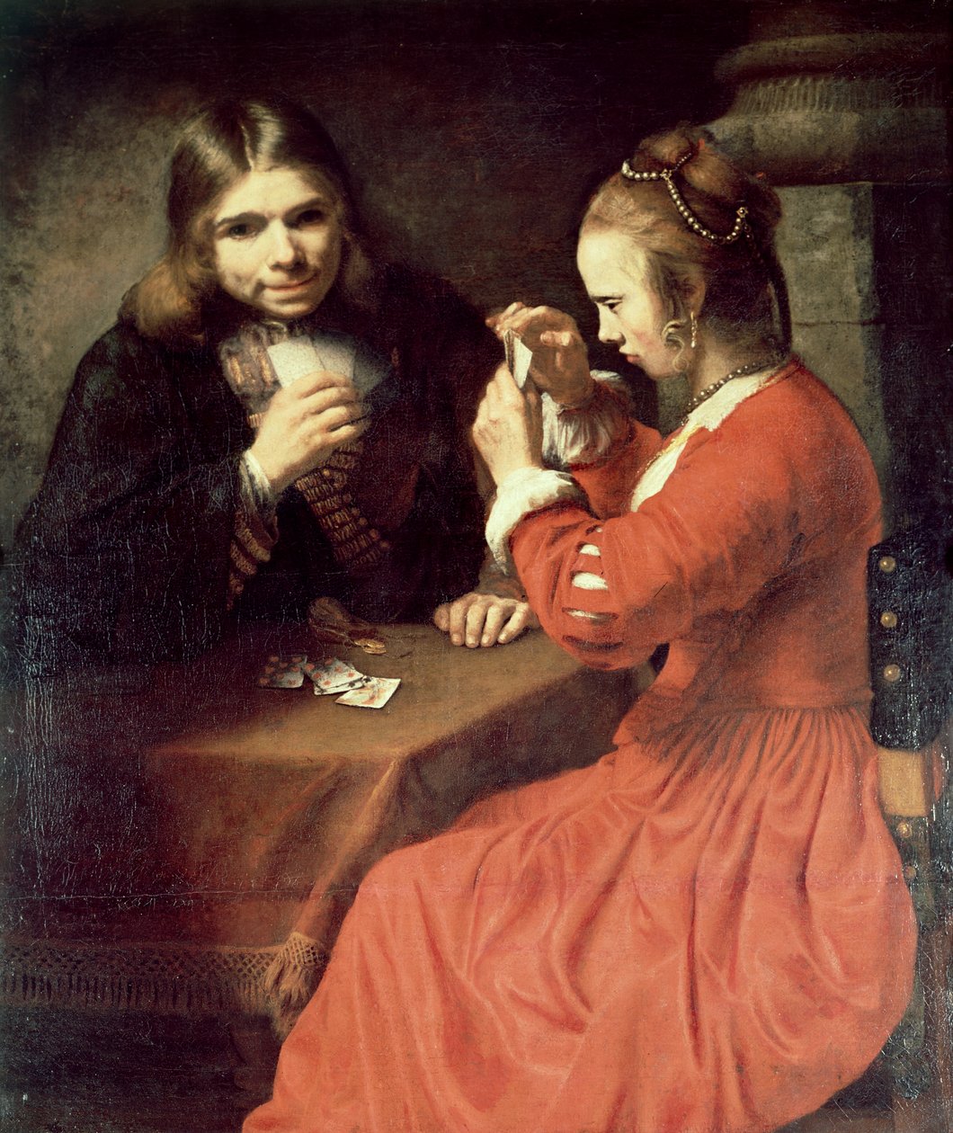 Młody mężczyzna i dziewczynka grają w karty autorstwa Rembrandt van Rijn