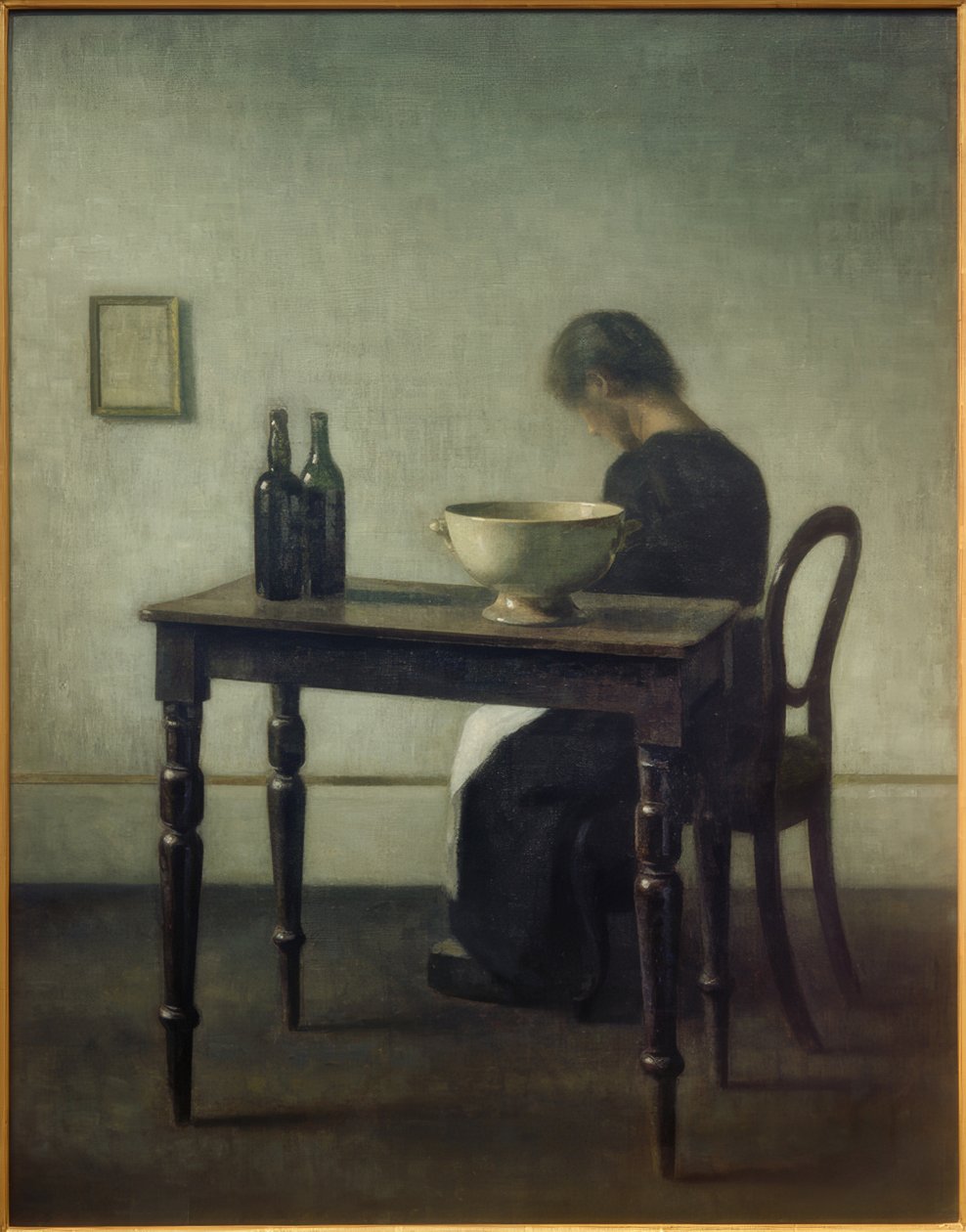 Kobieta siedząca za stołem autorstwa Vilhelm Hammershoi