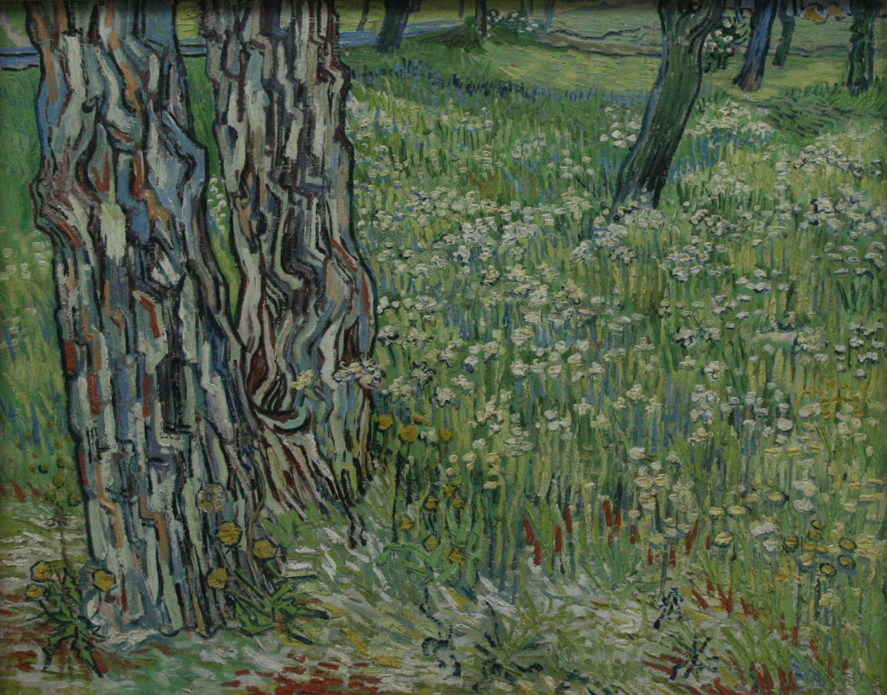 Pnie drzew w trawie autorstwa Vincent van Gogh